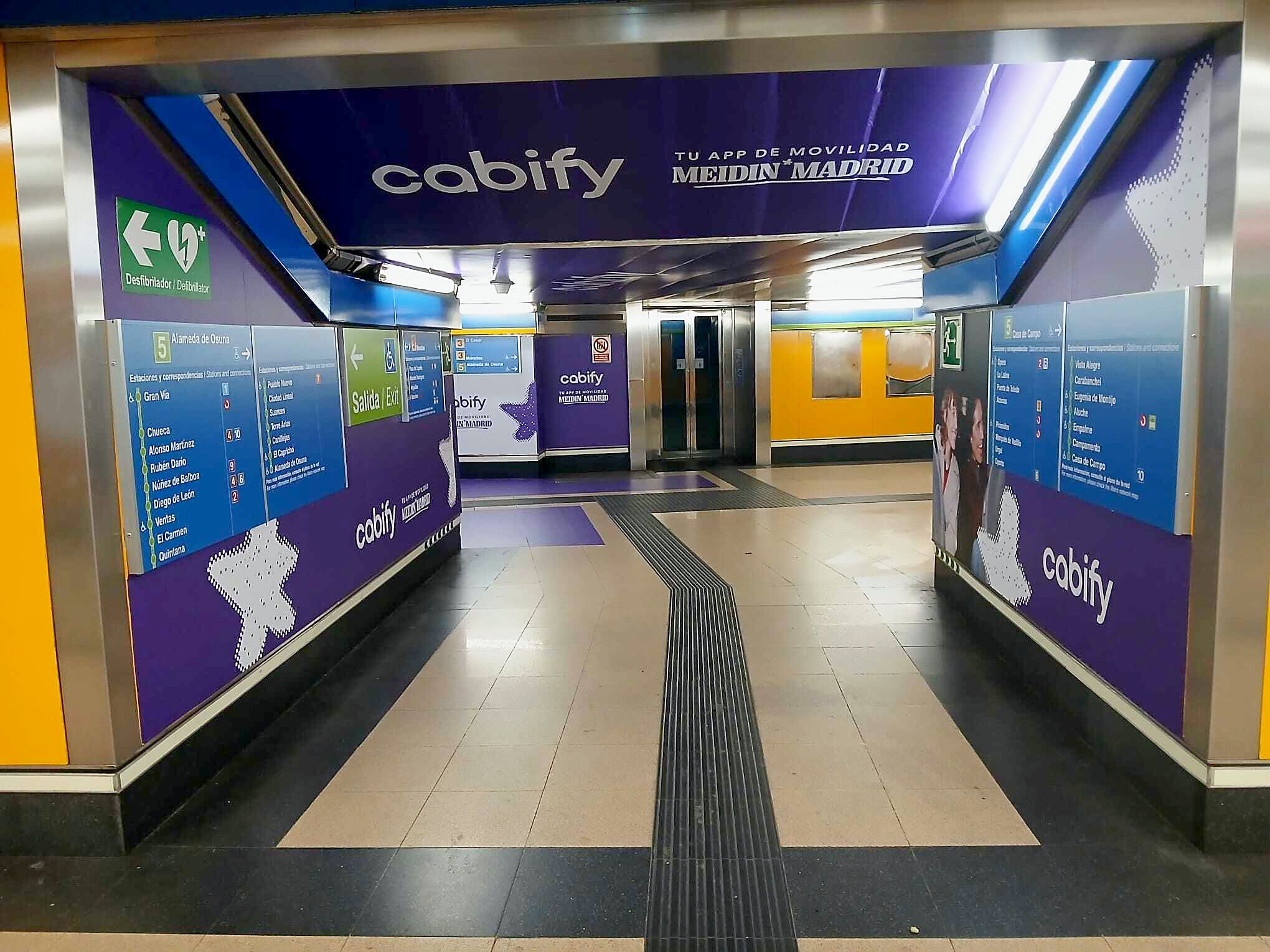 Station entrance branded with the Cabify logo