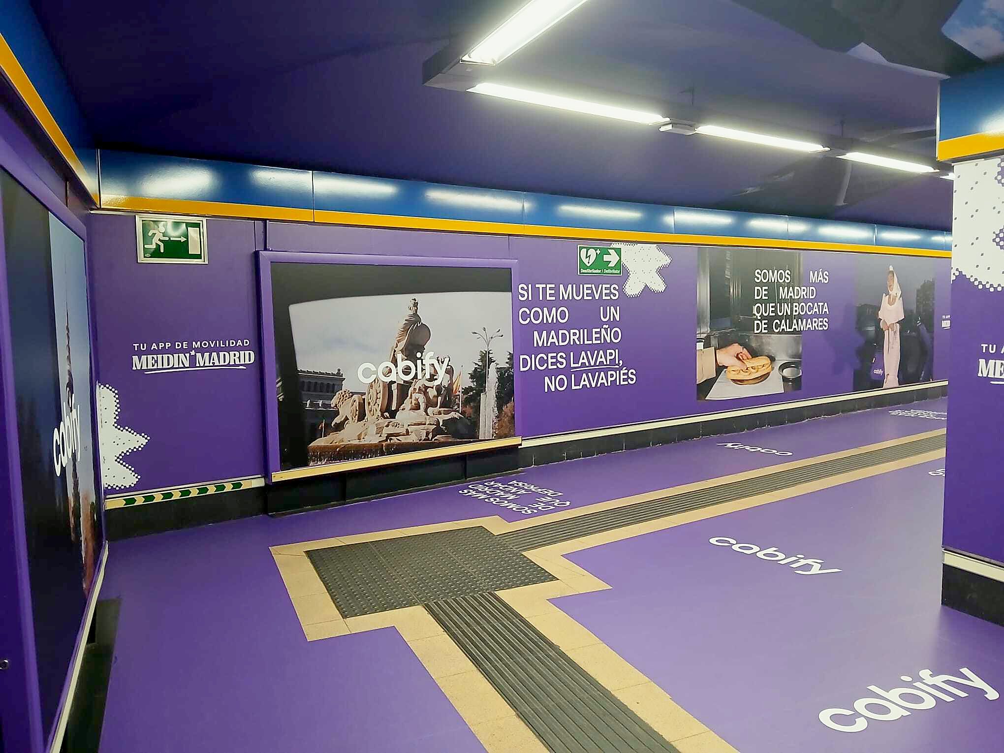 Floor-to-wall graphics around a corner of the corridor