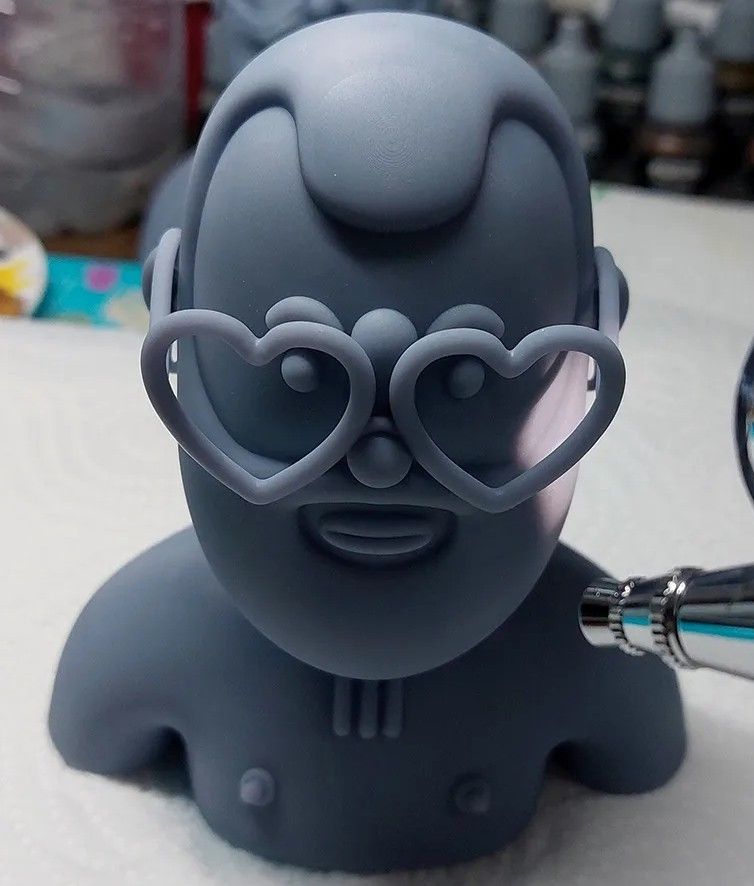 The same bust as a raw grey resin print, before painting