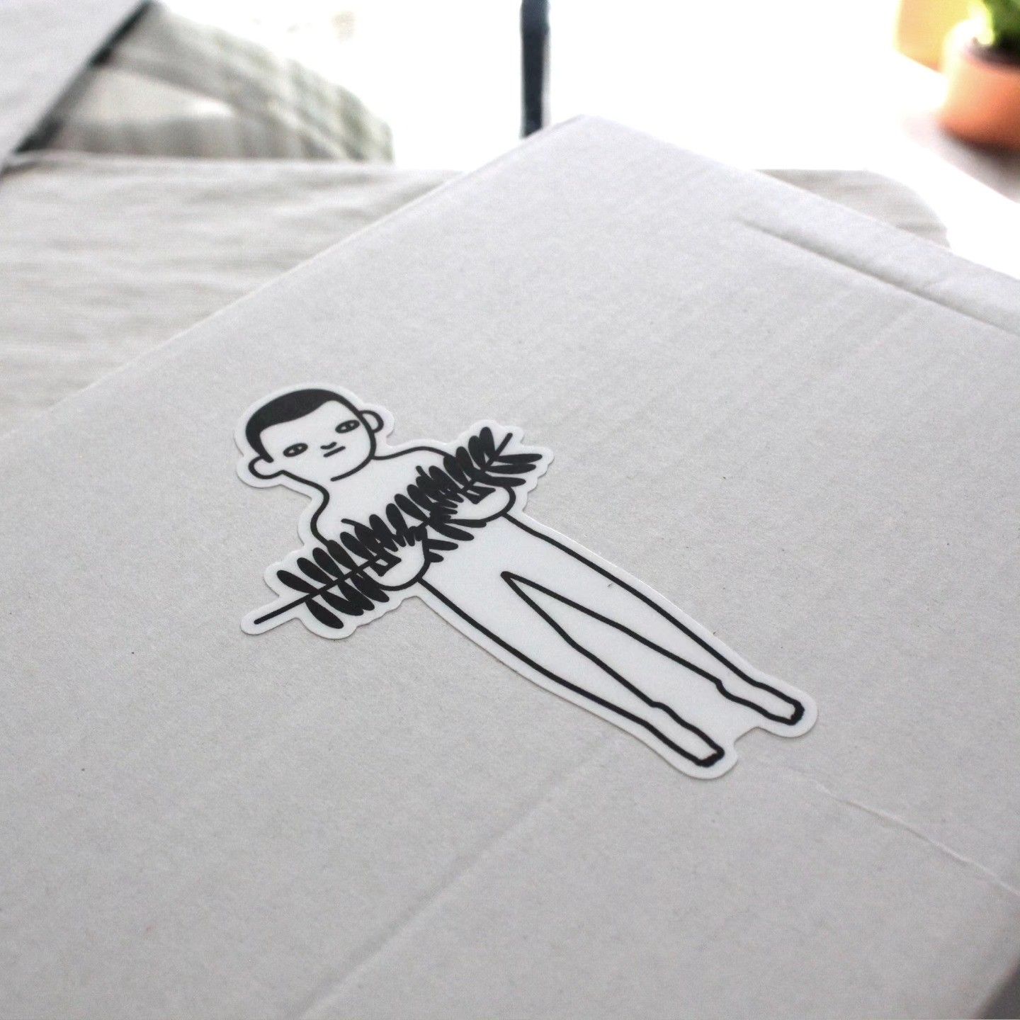 Original line drawing of the character holding a branch