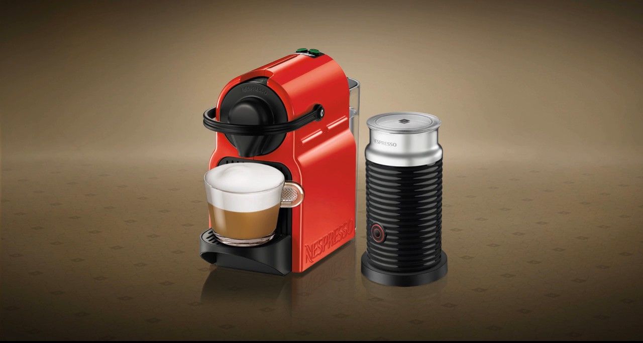 Inissia machine in red with an Aeroccino milk frother