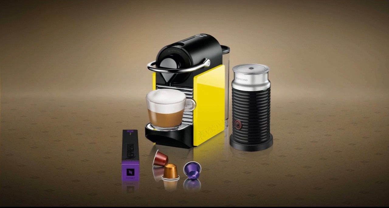 Pixie machine in yellow with capsules